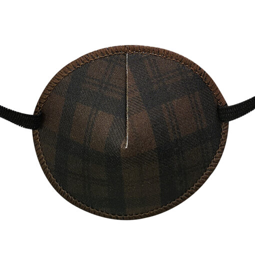 En ögonlapp med resår för vuxna. Den är i brunt, rutigt tyg med ett klassiskt check-mönster. Märket är Kay Fun Patch. Den heter Brown Check.